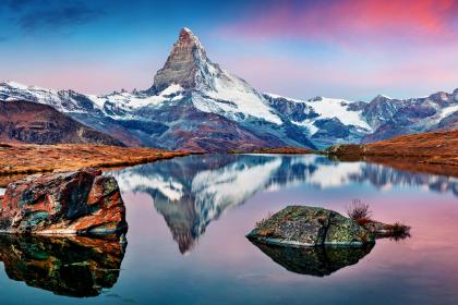 Panoramic morning view of Stellisee lake with Matterhorn / Cervino peak on background Panoramic morning view of Stellisee lake with Matterhorn / Cervino peak on background